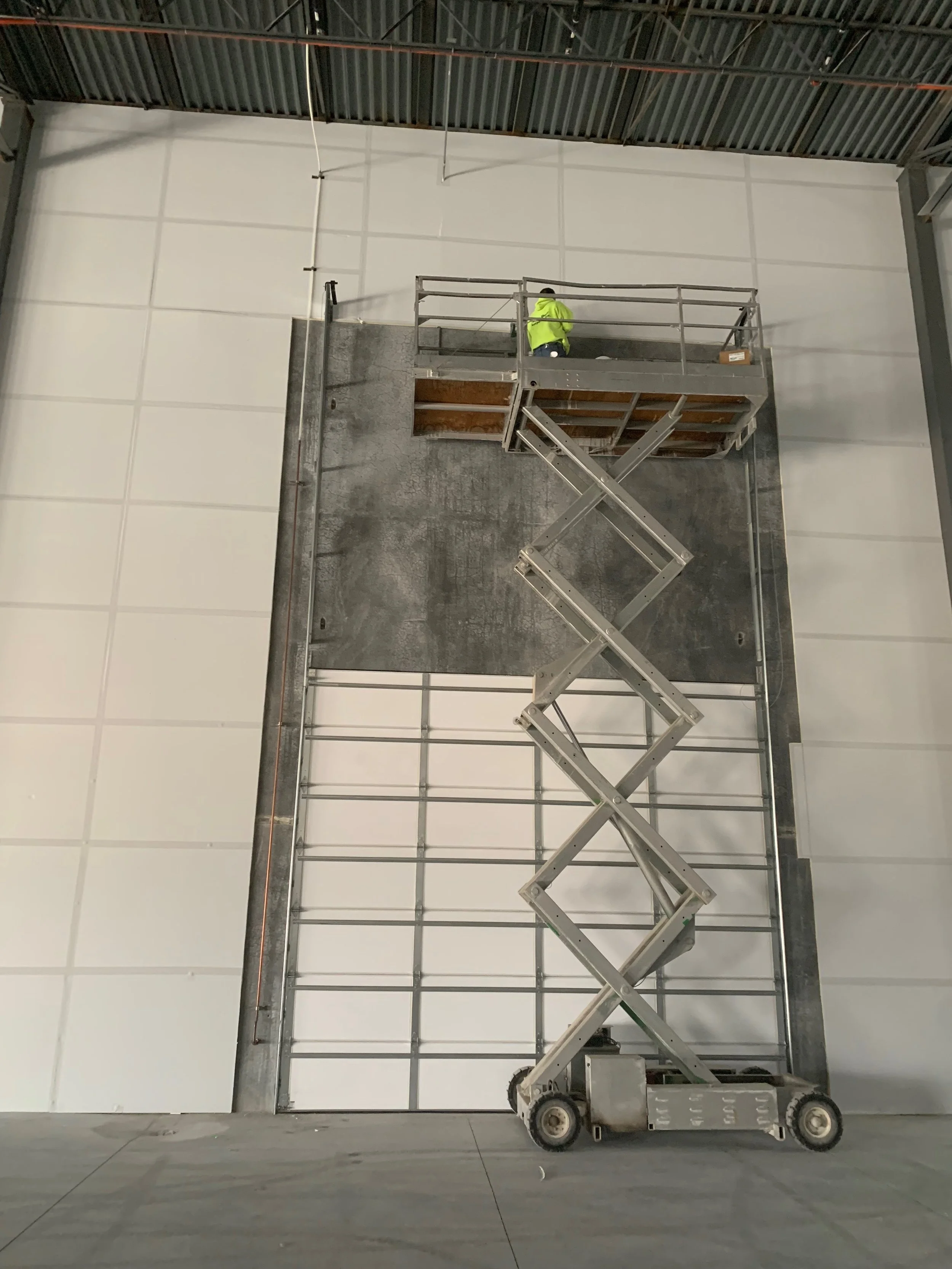 White sectional overhead doors on commercial building