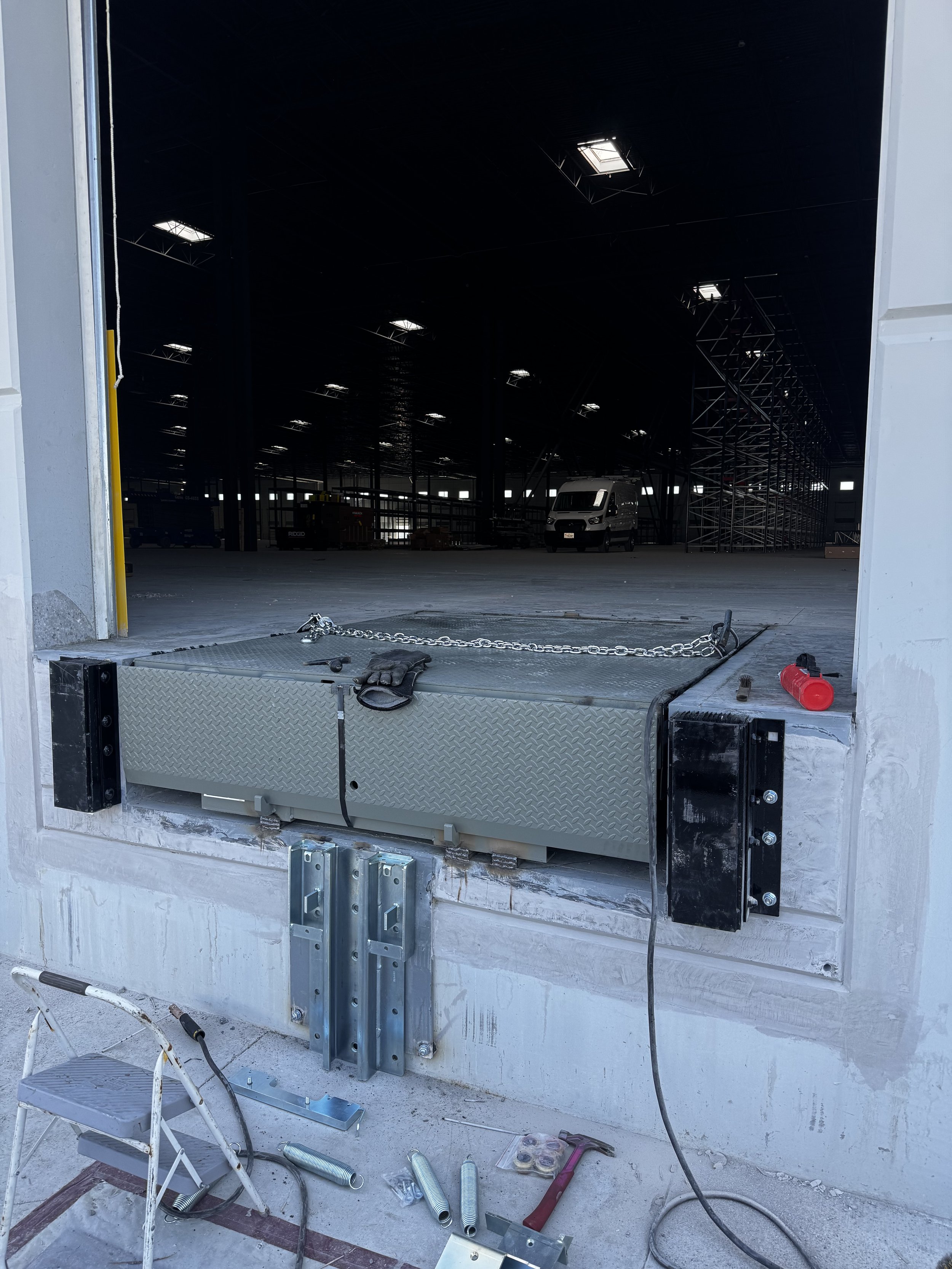 Dock leveler in large warehouse